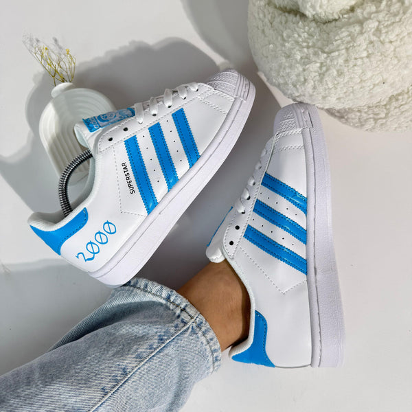 Zapatillas Adds Superstar 2000 – Blanco/Azul Retro